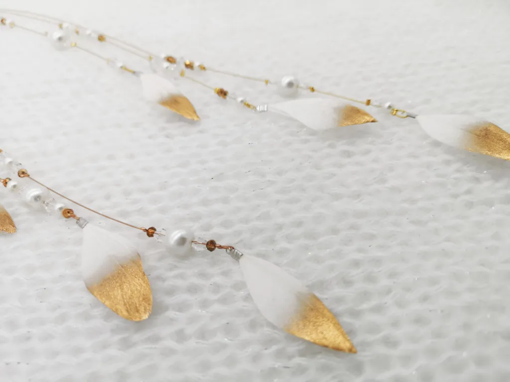 #feather charm